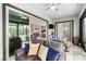 Bright sunroom with neutral decor and a view of the kitchen and outdoor living spaces at 731 Glowing Horizon St, Henderson, NV 89052