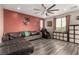 Comfortable living room with a large sectional sofa, massage chair, and modern ceiling fan at 731 Glowing Horizon St, Henderson, NV 89052
