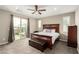 A main bedroom with a ceiling fan and access to a private balcony with beautiful views at 731 Glowing Horizon St, Henderson, NV 89052