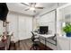 Functional home office with built-in desk, closet, and a comfortable workspace at 731 Glowing Horizon St, Henderson, NV 89052