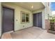 Covered patio with dual entry doors, a window and a stone accent wall with water feature at 731 Glowing Horizon St, Henderson, NV 89052