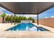 Backyard pool featuring a covered pergola, spa, waterfall feature, and patio area at 731 Glowing Horizon St, Henderson, NV 89052