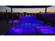 Stunning pool and spa featuring colorful lighting and modern design at 731 Glowing Horizon St, Henderson, NV 89052