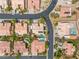 A high aerial view of a neighborhood with mature landscaping and community pools at 7401 Bridlehorne Ave, Las Vegas, NV 89131