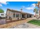 Exterior view of home featuring stucco walls, covered patio, desert landscaping, and swimming pool at 7401 Bridlehorne Ave, Las Vegas, NV 89131