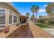 Outdoor patio and backyard featuring a lush lawn, desert rock and lounge furniture at 7401 Bridlehorne Ave, Las Vegas, NV 89131