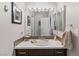 Bathroom features a decorative mirror and tile backsplash, enhancing its charm at 7401 Bridlehorne Ave, Las Vegas, NV 89131