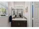 Bathroom with a stylish vanity, modern fixtures, and sleek mirror at 7401 Bridlehorne Ave, Las Vegas, NV 89131