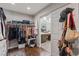 Walk-in closet with clothing racks and access to the bathroom at 7401 Bridlehorne Ave, Las Vegas, NV 89131