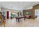 Bright and airy game room with a pool table, recessed lighting, and large windows with backyard views at 7401 Bridlehorne Ave, Las Vegas, NV 89131