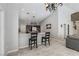 Stylish kitchen with granite countertops, an island with seating, and pendant lighting at 7401 Bridlehorne Ave, Las Vegas, NV 89131