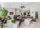 A spacious living room with tile floors, neutral colors, a ceiling fan and backyard access at 7401 Bridlehorne Ave, Las Vegas, NV 89131