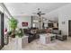 Comfortable living room with a gray sectional sofa, decorative pillows, and an open layout to the kitchen at 7401 Bridlehorne Ave, Las Vegas, NV 89131