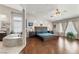 Large main bedroom with an ensuite bathroom featuring a large tub and natural light at 7401 Bridlehorne Ave, Las Vegas, NV 89131