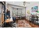 Bright home office space with natural light, hardwood floors, and built-in shelving at 7401 Bridlehorne Ave, Las Vegas, NV 89131