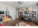 Spacious home office with wood floors, a ceiling fan, and plenty of natural light at 7401 Bridlehorne Ave, Las Vegas, NV 89131