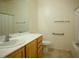 Bathroom featuring vanity and standard toilet, tub, and shower at 7668 Broadwing Dr, North Las Vegas, NV 89084
