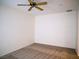 Standard bedroom with neutral carpet and ceiling fan for optimal comfort at 7668 Broadwing Dr, North Las Vegas, NV 89084