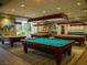 Community billiards room with well maintained tables and custom lighting at 7668 Broadwing Dr, North Las Vegas, NV 89084