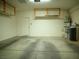 Spacious two car garage with lighting and installed storage solutions at 7668 Broadwing Dr, North Las Vegas, NV 89084