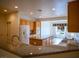 Spacious kitchen featuring a center island, granite counters, and modern appliances at 7668 Broadwing Dr, North Las Vegas, NV 89084