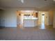 Open living space with a view of the kitchen featuring a breakfast bar at 7668 Broadwing Dr, North Las Vegas, NV 89084