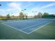 Outdoor tennis court with professional lines and nets for recreational play at 7668 Broadwing Dr, North Las Vegas, NV 89084