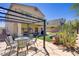 The backyard has artificial turf, a covered patio, a metal pergola, and mature desert landscaping at 776 Flowing Meadow Dr, Henderson, NV 89014