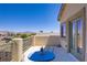 Enjoy mountain views from this balcony complete with a patio set for lounging at 776 Flowing Meadow Dr, Henderson, NV 89014