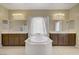 Luxurious bathroom features a soaking tub, dual sinks, and a glass shower at 776 Flowing Meadow Dr, Henderson, NV 89014