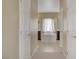 The primary en-suite bathroom offers a soaking tub between and vanities at 776 Flowing Meadow Dr, Henderson, NV 89014