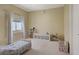 Cozy bedroom boasts a twin bed, carpet floors, and neutral-colored walls at 776 Flowing Meadow Dr, Henderson, NV 89014