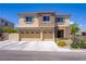 Charming two-story home with a three-car garage and desert landscaping at 776 Flowing Meadow Dr, Henderson, NV 89014