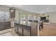 Open-concept kitchen and living area with an island and modern finishes at 776 Flowing Meadow Dr, Henderson, NV 89014