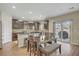 Eat-in kitchen with dark cabinetry, modern appliances, and sliding glass doors to the backyard at 776 Flowing Meadow Dr, Henderson, NV 89014