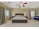 Spacious main bedroom boasts a ceiling fan, neutral walls, and carpet flooring at 776 Flowing Meadow Dr, Henderson, NV 89014