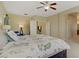 Spacious main bedroom offers a ceiling fan and doorway into another room at 776 Flowing Meadow Dr, Henderson, NV 89014