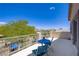Spacious patio with mountain views, complemented by a charming blue outdoor seating set at 776 Flowing Meadow Dr, Henderson, NV 89014