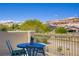 Enjoy the view from this covered patio with table and chairs at 776 Flowing Meadow Dr, Henderson, NV 89014