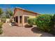 View of the back of the home with stucco exterior and minimal landscaping at 8028 Hurricane Cove Ct, Las Vegas, NV 89129