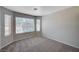 Bedroom features carpet, neutral walls, and several bright windows at 8028 Hurricane Cove Ct, Las Vegas, NV 89129