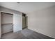 Bedroom features carpet, neutral walls, and a closet with sliding doors at 8028 Hurricane Cove Ct, Las Vegas, NV 89129