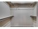Spacious walk-in closet with shelving and hanging rods for ample storage at 8028 Hurricane Cove Ct, Las Vegas, NV 89129