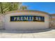 Community sign that reads 'Premiere' with stone and stucco surround at 8028 Hurricane Cove Ct, Las Vegas, NV 89129