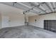 Spacious garage with concrete flooring and a door to the inside at 8028 Hurricane Cove Ct, Las Vegas, NV 89129