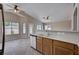 Eat in kitchen with ceiling fans, stainless steel appliances, lots of natural light, and breakfast bar at 8028 Hurricane Cove Ct, Las Vegas, NV 89129