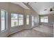 Cozy living area with tile floors and plenty of sunlight from the many windows at 8028 Hurricane Cove Ct, Las Vegas, NV 89129