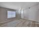 Bright living room with hardwood floors and large window at 8028 Hurricane Cove Ct, Las Vegas, NV 89129