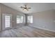 Bright living room with vaulted ceiling, wood floors, and access to the backyard at 8028 Hurricane Cove Ct, Las Vegas, NV 89129