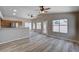 Bright living room with wood floors, lots of windows and ceiling fans at 8028 Hurricane Cove Ct, Las Vegas, NV 89129